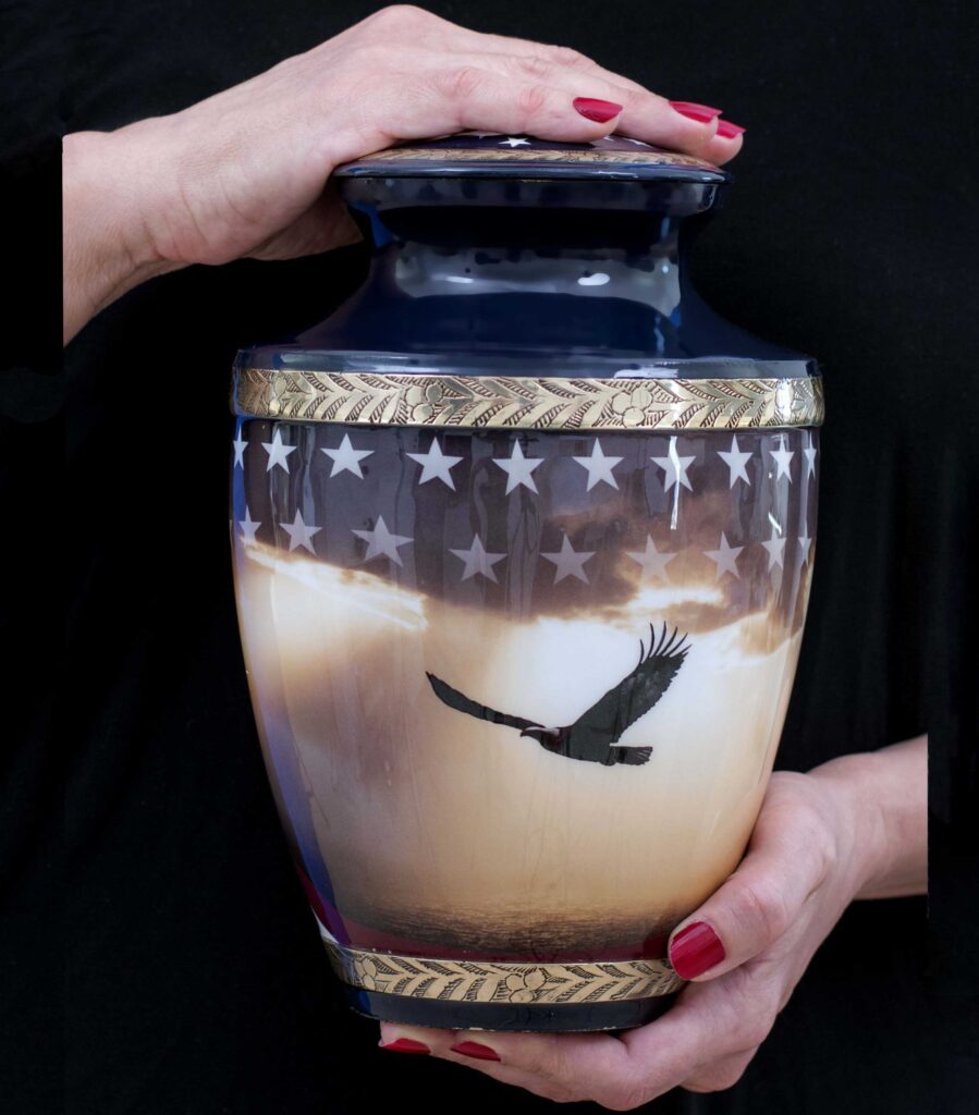 Large urn for ashes patriotic american held in hands to show size